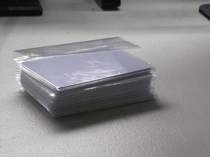 A stack of white cards in a plastic bag
AI-generated content may be incorrect.