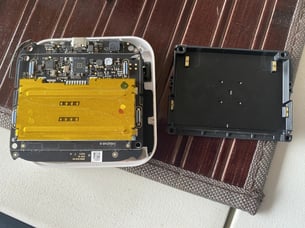 A white box with a yellow rectangular object on a brown surface
AI-generated content may be incorrect.