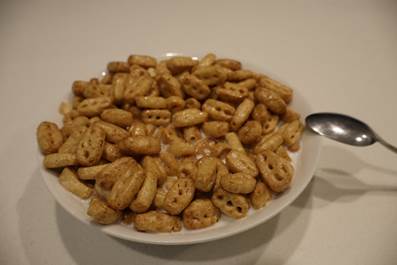 A bowl of cereal with a spoon
AI-generated content may be incorrect.