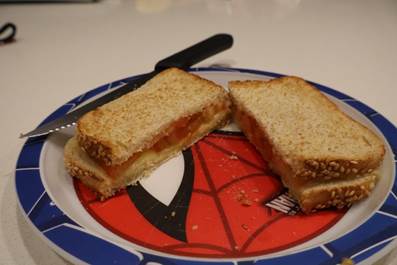 A sandwich cut in half on a plate
AI-generated content may be incorrect.