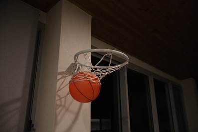 A basketball in a hoop
AI-generated content may be incorrect.