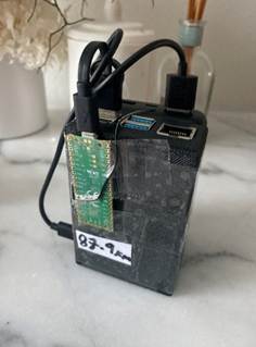 A black box with wires
AI-generated content may be incorrect.